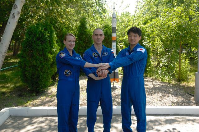 NASA image: At the Cosmonaut Hotel in Baikonur, Kazakhstan, Expedition 48-49 crewmembers Kate Rubins of NASA (left), Anatoly Ivanishin of Roscosmos (center) and Takuya Onishi of the Japan Aerospace Exploration Agency (right) pose for pictures June 30 during traditional pre-launch activities. Rubins, Ivanishin and Onishi will launch July 7, Baikonur time, on the Soyuz MS-01 spacecraft for a planned four-month mission on the International Space Station...NASA/Alexander Vysotsky.