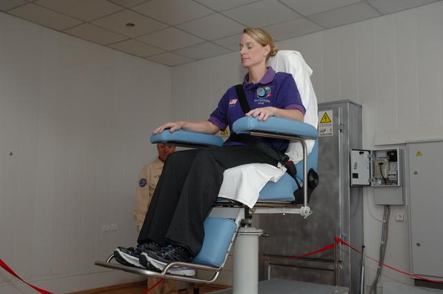 NASA image: At the Cosmonaut Hotel in Baikonur, Kazakhstan, Expedition 48-49 crewmember Kate Rubins of NASA takes a spin in a rotating chair to test her vestibular system June 30 as part of pre-launch activities. Rubins, Anatoly Ivanishin of Roscosmos and Takuya Onishi of the Japan Aerospace Exploration Agency will launch July 7, Baikonur time, on the Soyuz MS-01 spacecraft for a planned four-month mission on the International Space Station...NASA/Alexander Vysotsky.