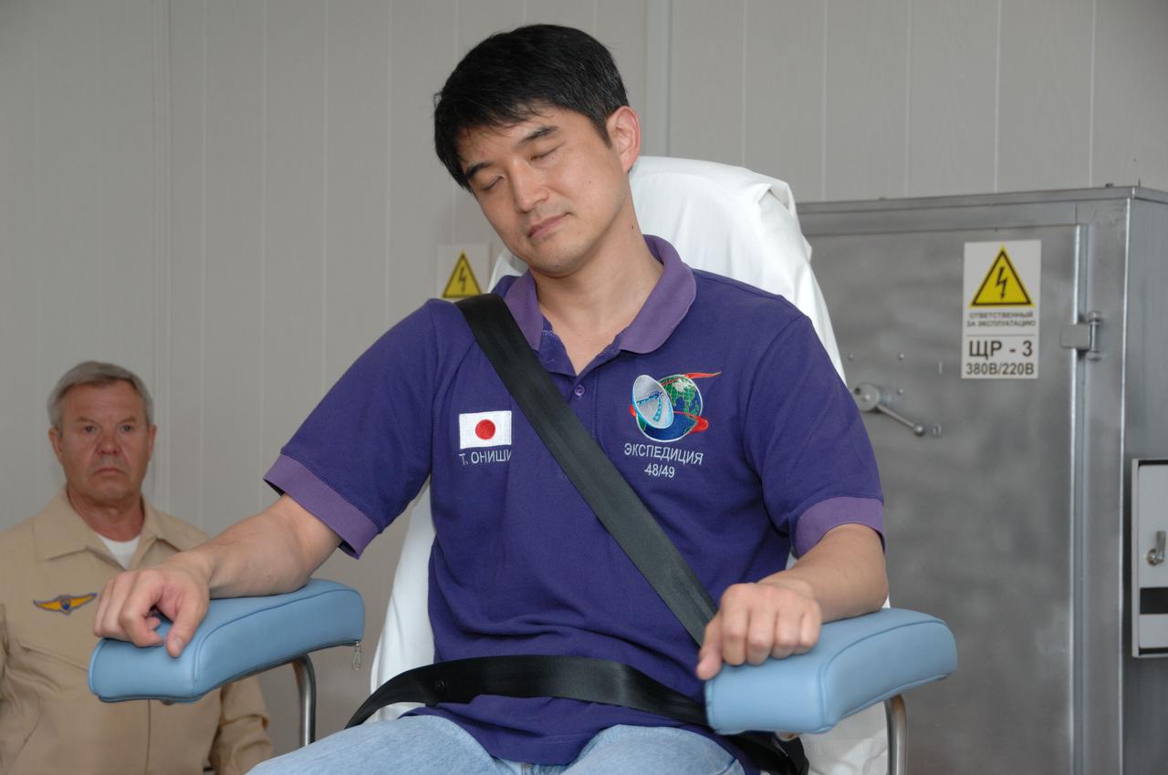 At the Cosmonaut Hotel in Baikonur, Kazakhstan, Expedition 48-49 crewmember Takuya Onishi of the Japan Aerospace Exploration Agency takes a spin in a rotating chair to test his vestibular system June 30 as part of pre-launch activities. Onishi, Kate Rubins of NASA and Anatoly Ivanishin of Roscosmos will launch July 7, Baikonur time, on the Soyuz MS-01 spacecraft for a planned four-month mission on the International Space Station.  NASA/Alexander Vysotsky 