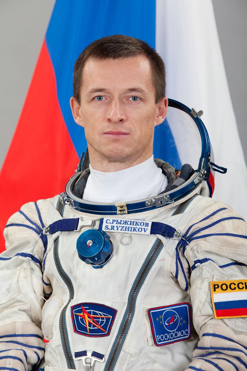 JSC2016e105228 (08/16/2016) --- Russian cosmonaut Sergey Ryzhikov sits for an official portrait for Expedition 49  to the International Space Station.