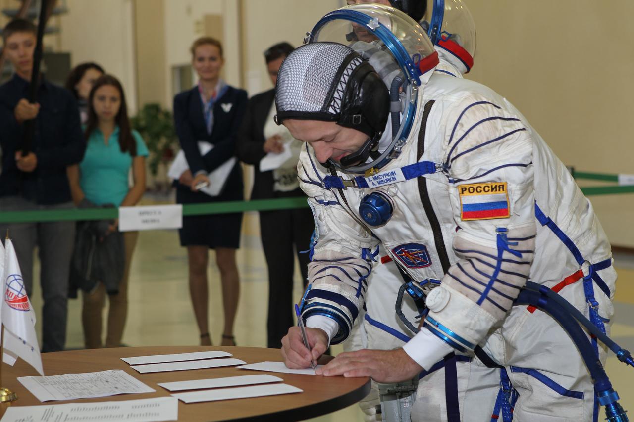 At the Gagarin Cosmonaut Training Center in Star City, Russia, Expedition 49-50 backup crewmember Alexander Misurkin of Roscosmos signs in Aug. 30 for the start of final qualification exams. Misurkin, Mark Vande Hei of NASA and Nikolai Tikhonov of Roscosmos are serving as backups to prime crewmembers Shane Kimbrough of NASA and Andrey Borisenko and Sergey Ryzhikov of Roscosmos who will launch on Sept. 24 (Kazakh time) on their Soyuz MS-02 vehicle from the Baikonur Cosmodrome in Kazakhstan for a five-month mission on the International Space Station. NASA/Stephanie Stoll