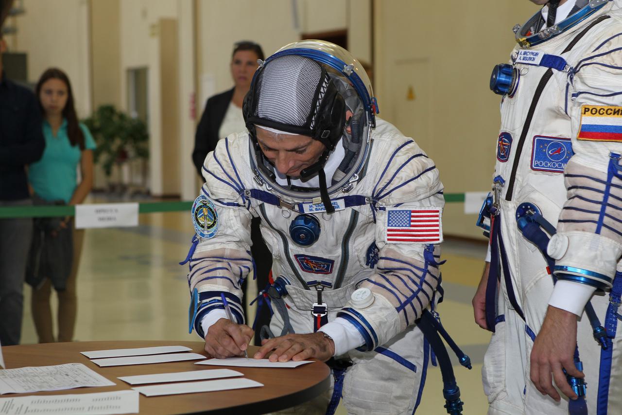 At the Gagarin Cosmonaut Training Center in Star City, Russia, Expedition 49-50 backup crewmember Mark Vande Hei of NASA signs in Aug. 30 for the start of final qualification exams. Vande Hei and Alexander Misurkin and Nikolai Tikhonov of Roscosmos are serving as backups to prime crewmembers Shane Kimbrough of NASA and Andrey Borisenko and Sergey Ryzhikov of Roscosmos who will launch on Sept. 24 (Kazakh time) on their Soyuz MS-02 vehicle from the Baikonur Cosmodrome in Kazakhstan for a five-month mission on the International Space Station. NASA/Stephanie Stoll