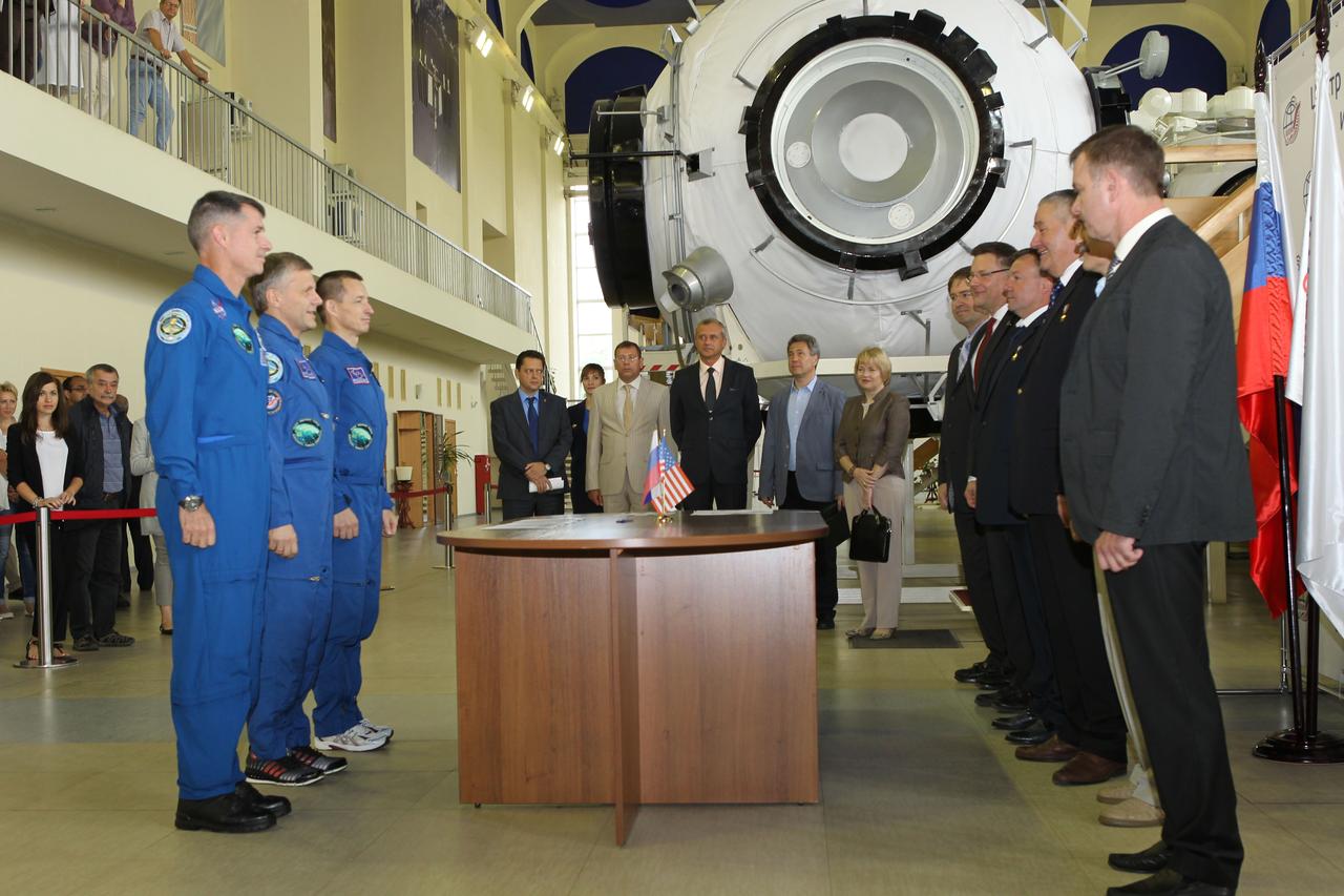 At the Gagarin Cosmonaut Training Center in Star City, Russia, Expedition 49-50 prime crewmembers Shane Kimbrough of NASA (left) and Andrey Borisenko (center) and Sergey Ryzhikov (right) of Roscosmos report to officials Aug. 30 for the start of two days of final qualification exams. The trio is preparing for launch on Sept. 24 (Kazakh time) on their Soyuz MS-02 vehicle from the Baikonur Cosmodrome in Kazakhstan for a five-month mission on the International Space Station. NASA/Stephanie Stoll