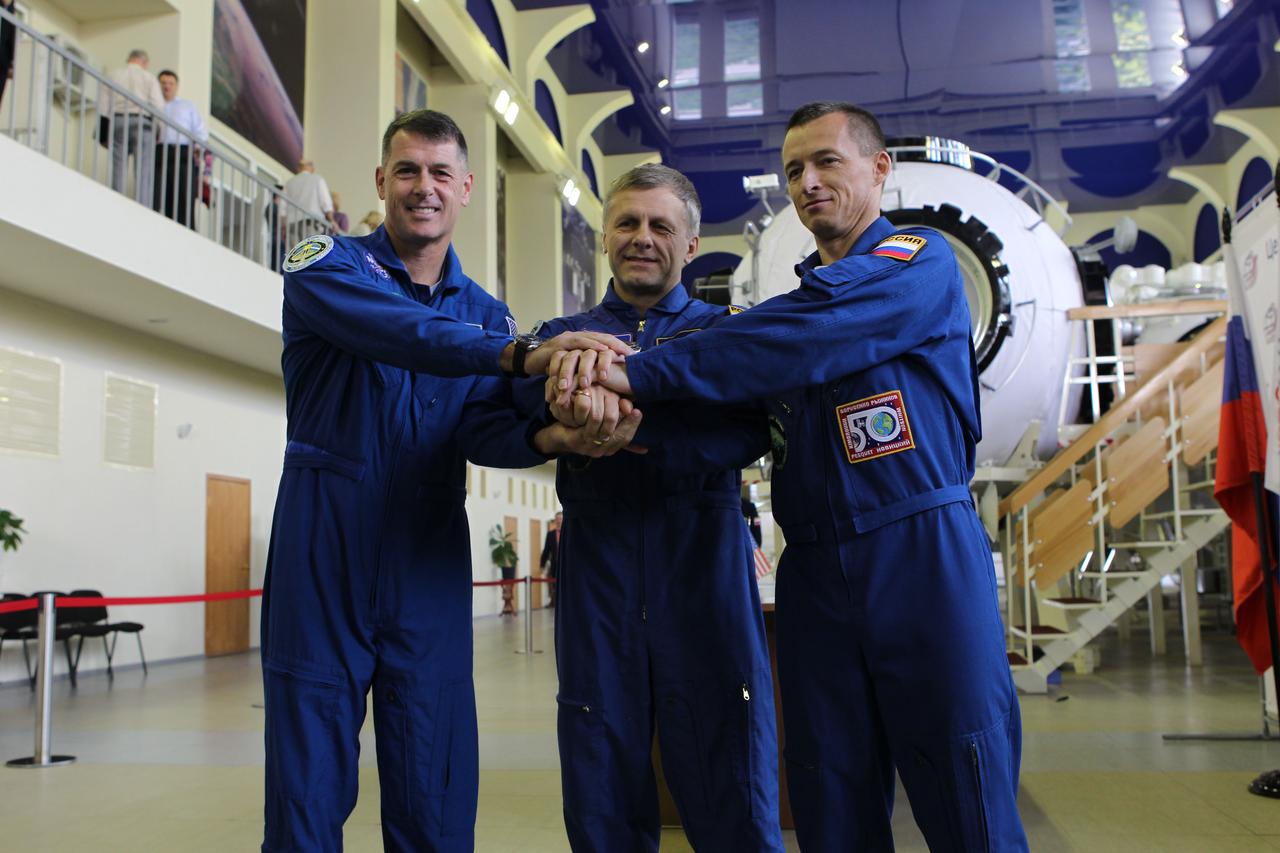 At the Gagarin Cosmonaut Training Center in Star City, Russia, Expedition 49-50 prime crewmembers Shane Kimbrough of NASA (left) and Andrey Borisenko (center) and Sergey Ryzhikov (right) of Roscosmos pose for pictures Aug. 30 at the start of two days of final qualification exams. The trio is preparing for launch on Sept. 24 (Kazakh time) on their Soyuz MS-02 vehicle from the Baikonur Cosmodrome in Kazakhstan for a five-month mission on the International Space Station. NASA/Stephanie Stoll