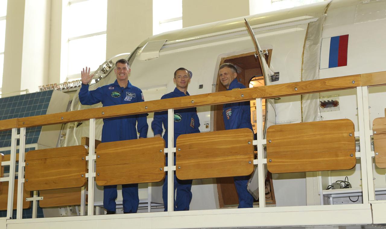 At the Gagarin Cosmonaut Training Center in Star City, Russia, Expedition 49-50 prime crewmembers Shane Kimbrough of NASA (left) and Andrey Borisenko (center) and Sergey Ryzhikov (right) of Roscosmos wave to reporters Aug. 30 at the start of two days of final qualification exams. The trio is preparing for launch on Sept. 24 (Kazakh time) on their Soyuz MS-02 vehicle from the Baikonur Cosmodrome in Kazakhstan for a five-month mission on the International Space Station. NASA/Stephanie Stoll