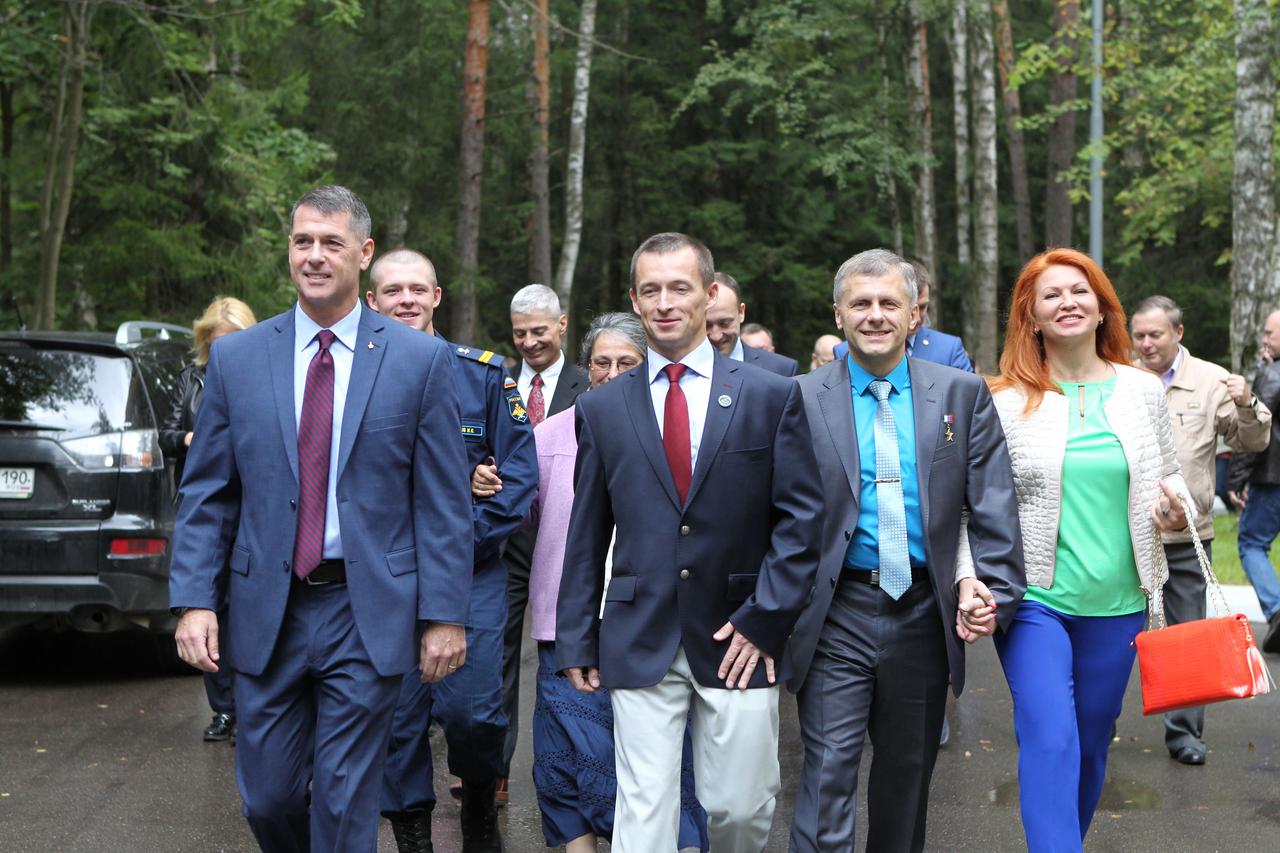 At the Gagarin Cosmonaut Training Center in Star City, Russia, Expedition 49 crewmembers Shane Kimbrough of NASA (left) and Sergey Ryzhikov (center) and Andrey Borisenko (right) of Roscosmos walk to busses Sept. 8 that will take them to nearby Chkalovsky Airfield and a flight to the launch site at the Baikonur Cosmodrome in Kazakhstan, where they will launch on Sept. 24, Kazakh time on the Soyuz MS-02 spacecraft for a five-month mission on the International Space Station.  NASA/Stephanie Stoll 