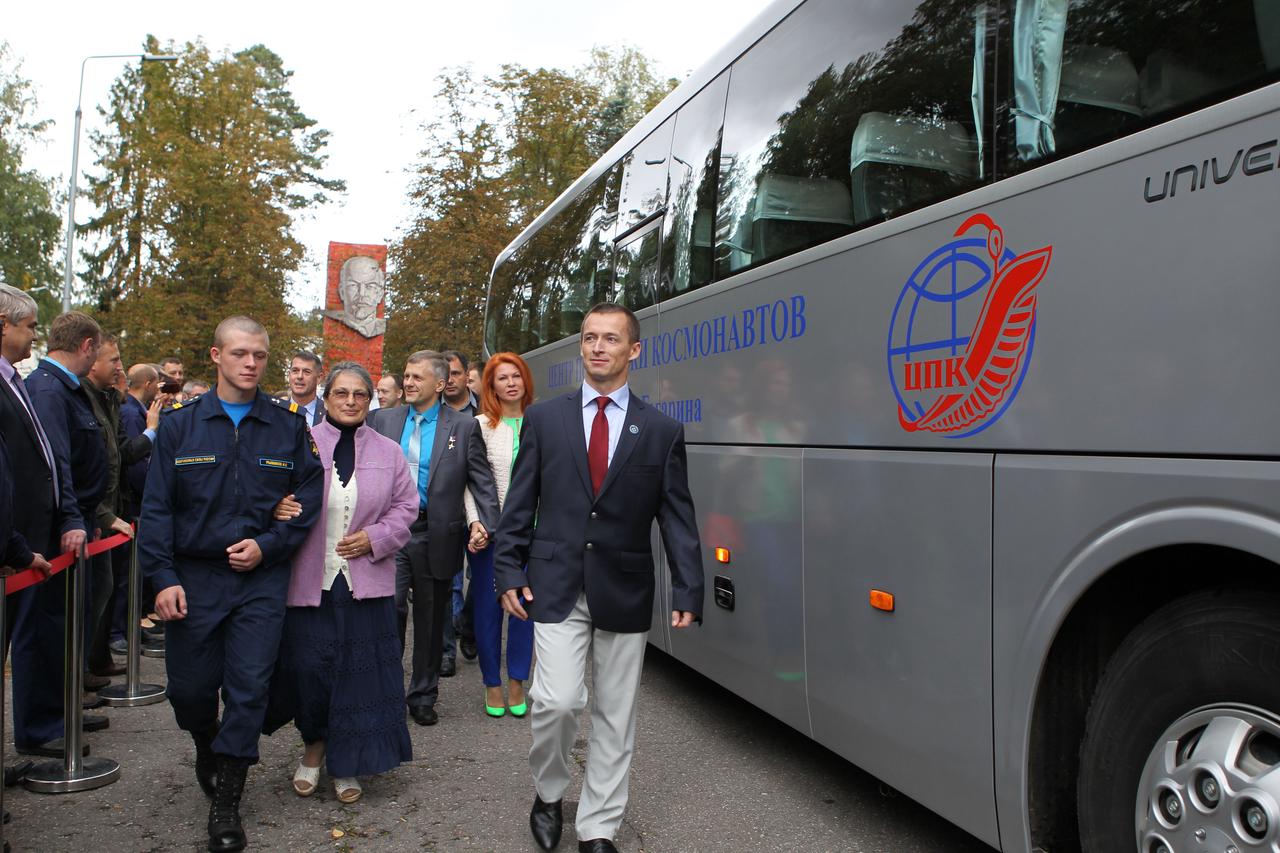 At the Gagarin Cosmonaut Training Center in Star City, Russia, Expedition 49 crewmember Sergey Ryzhikov leads a crowd of people to a waiting bus Sept. 8 that took him, Shane Kimbrough of NASA and Andrey Borisenko of Roscosmos to nearby Chkalovsky Airfield and a flight to the launch site at the Baikonur Cosmodrome in Kazakhstan, where they will launch on Sept. 24, Kazakh time on the Soyuz MS-02 spacecraft for a five-month mission on the International Space Station.  NASA/Stephanie Stoll 