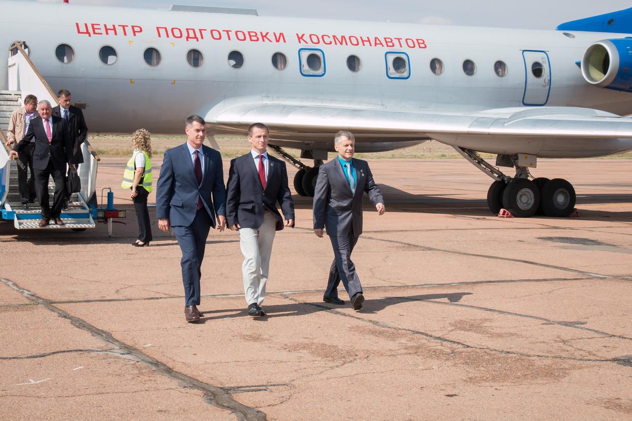 Expedition 49 crewmembers Shane Kimbrough of NASA (left) and Sergey Ryzhikov (center) and Andrey Borisenko (right) of Roscosmos arrive in Baikonur, Kazakhstan Sept. 8 for final pre-launch training after a flight from their base at the Gagarin Cosmonaut Training Center in Star City, Russia. The trio will launch on Sept. 24, Kazakh time on the Soyuz MS-02 spacecraft for a five-month mission on the International Space Station.  NASA/Victor Zelentsov 
