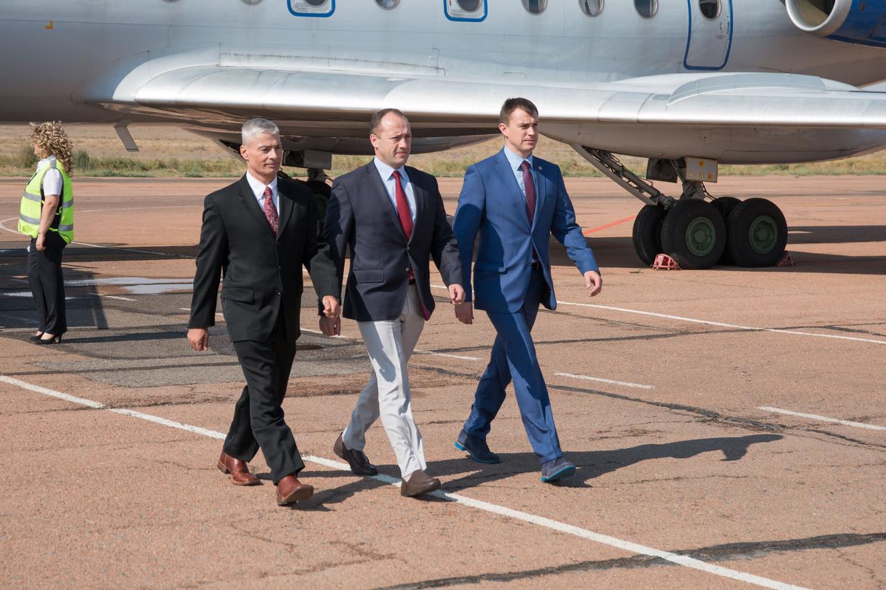 Expedition 49 backup crewmembers Mark Vande Hei of NASA (left) and Alexander Misurkin (center) and Nikolai Tikhonov (right) of Roscosmos arrive in Baikonur, Kazakhstan Sept. 8 for final pre-launch training after a flight from their base at the Gagarin Cosmonaut Training Center in Star City, Russia. The trio will serve as backups to prime crewmembers Shane Kimbrough of NASA and Sergey Ryzhikov and Andrey Borisenko of Roscosmos, who will launch on Sept. 24, Kazakh time on the Soyuz MS-02 spacecraft for a five-month mission on the International Space Station. NASA/Victor Zelentsov