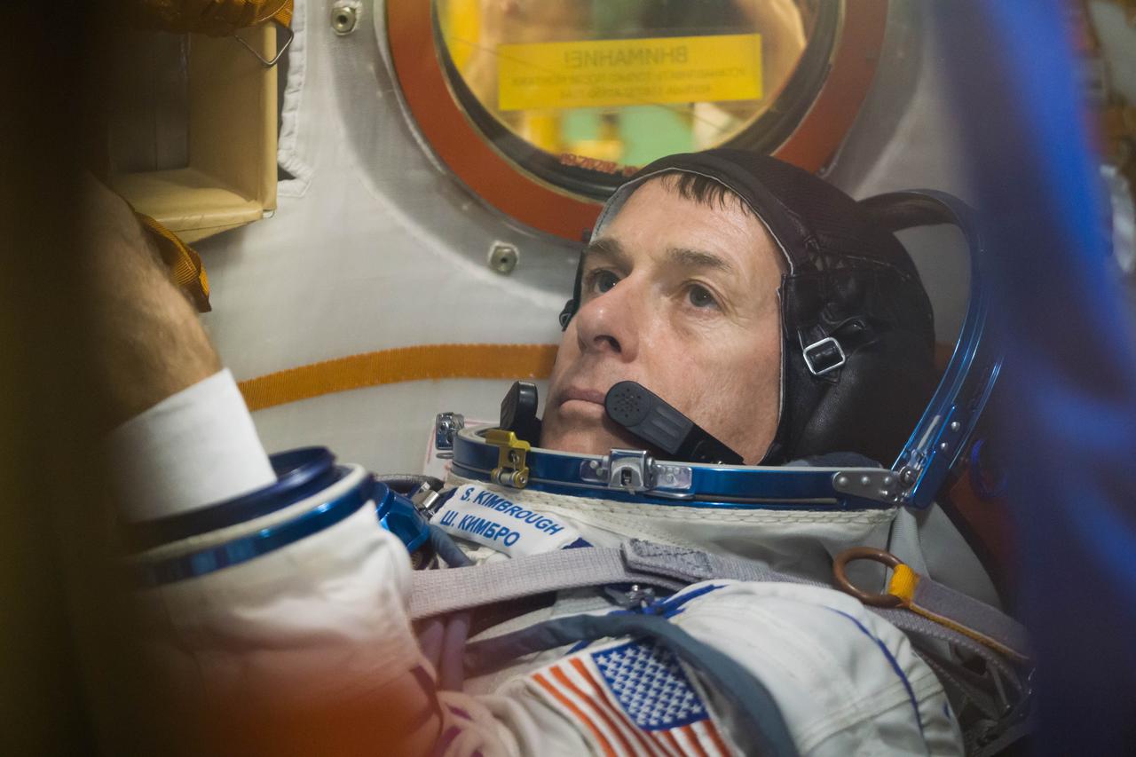 At the Integration Facility at the Baikonur Cosmodrome in Kazakhstan, Expedition 49 crewmember Shane Kimbrough of NASA conducts procedures inside the Soyuz MS-02 spacecraft Sept. 9 during a pre-launch training fit check. Kimbrough and Sergey Ryzhikov and Andrey Borisenko of Roscosmos will launch Sept. 24, Kazakh time on the Soyuz MS-02 vehicle for a five-month mission on the International Space Station.  NASA/Victor Zelentsov 