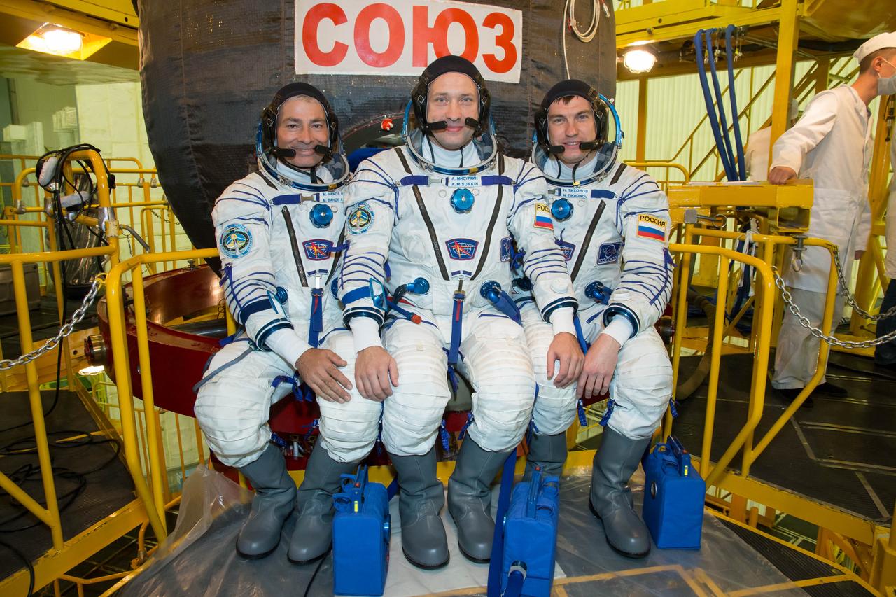 At the Integration Facility at the Baikonur Cosmodrome in Kazakhstan, Expedition 49 backup crewmembers Mark Vande Hei of NASA (left) and Alexander Misurkin (center) and Nikolai Tikhonov (right) of Roscosmos pose for pictures Sept. 9 in front of the Soyuz MS-02 spacecraft during a pre-launch training fit check. They will back up the prime crewmembers, Shane Kimbrough of NASA and Sergey Ryzhikov and Andrey Borisenko of Roscosmos, who will launch Sept. 24, Kazakh time on the Soyuz MS-02 vehicle for a five-month mission on the International Space Station. NASA/Victor Zelentsov