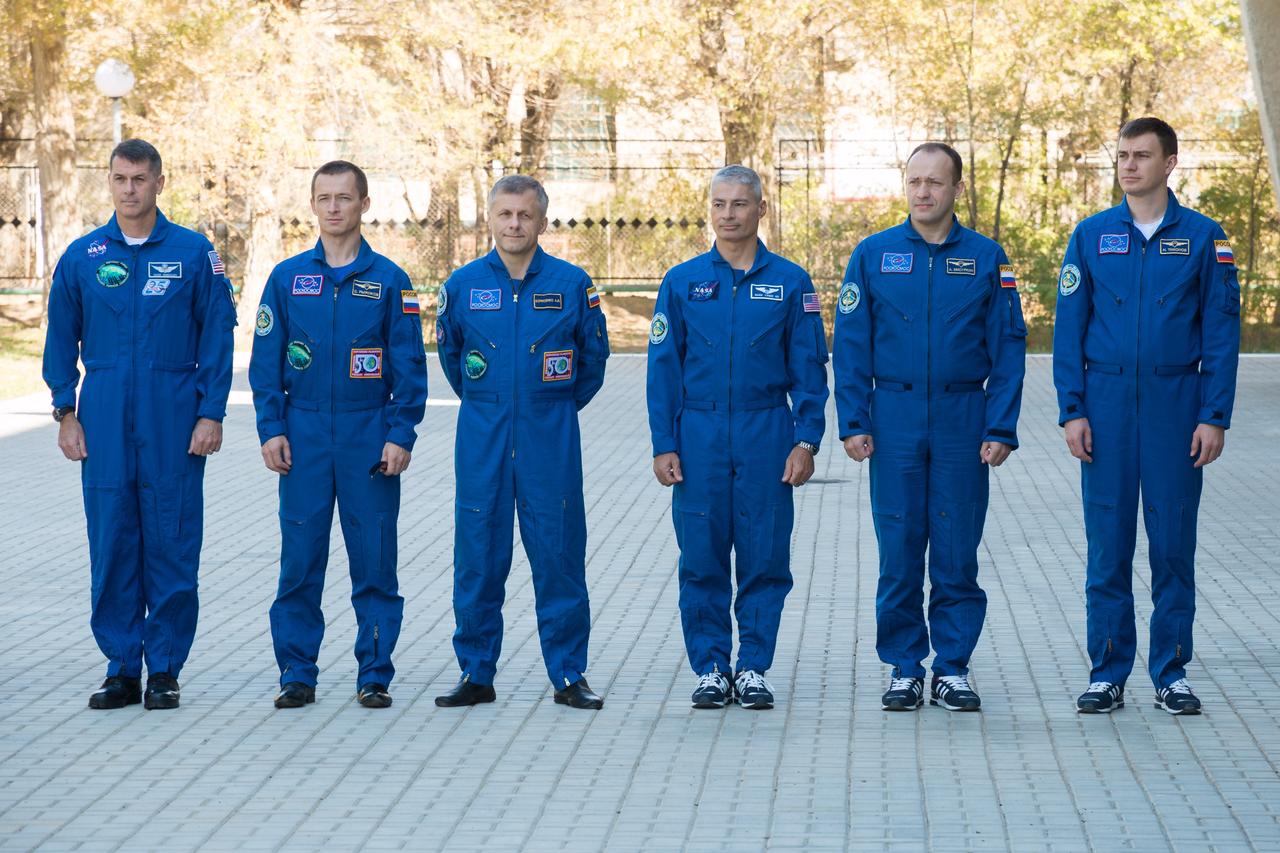 At their Cosmonaut Hotel crew quarters in Baikonur, Kazakhstan, the Expedition 49 crewmembers participate in a traditional flag-raising ceremony Sept. 10. From left to right are prime crewmembers Shane Kimbrough of NASA, Sergey Ryzhikov and Andrey Borisenko of Roscosmos and backup crewmembers Mark Vande Hei of NASA and Alexander Misurkin and Nikolai Tikhonov of Roscosmos. Kimbrough, Ryzhikov and Borisenko will launch on Sept. 24, Kazakh time from the Baikonur Cosmodrome in Kazakhstan on the Soyuz MS-02 vehicle for a five-month mission on the International Space Station. NASA/Victor Zelentsov