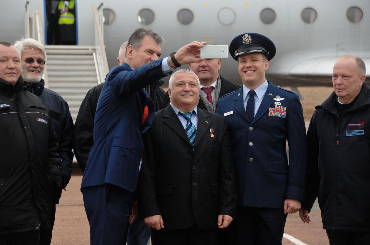 At the launch site in Baikonur, Kazakhstan, Expedition 50-51 backup crewmembers Paolo Nespoli of the European Space Agency (left), Fyodor Yurchikhin of the Russian Federal Space Agency (Roscosmos, center) and Jack Fischer of NASA (right) smile for a selfie Nov. 1 upon their arrival following a flight from their training base in Star City, Russia. They are the backups to Peggy Whitson of NASA, Oleg Novitskiy of the Russian Federal Space Agency (Roscosmos) and Thomas Pesquet of the European Space Agency, who will launch Nov. 18, Baikonur time, on the Soyuz MS-03 spacecraft for a six-month mission on the International Space Station. NASA/Alexander Vysotsky