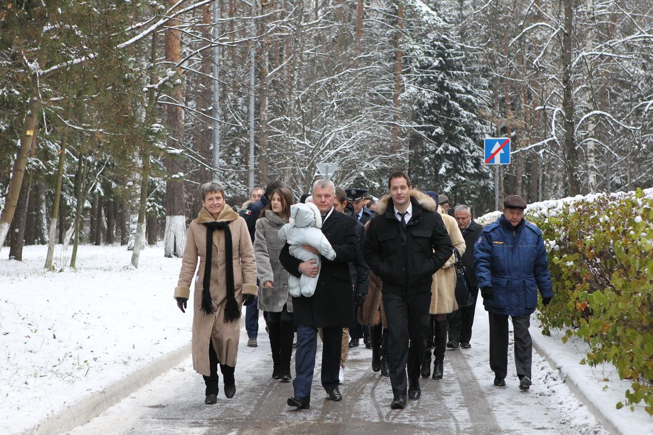 At the Gagarin Cosmonaut Training Center in Star City, Russia, Expedition 50-51 crewmembers Peggy Whitson of NASA (left), Oleg Novitskiy of the Russian Federal Space Agency (Roscosmos, center, holding his daughter) and Thomas Pesquet of the European Space Agency (right) walk to a bus Nov. 1 that will take them to their plane to fly to their launch site in Baikonur, Kazakhstan. The trio will launch Nov. 18, Baikonur time, on the Soyuz MS-03 spacecraft for a six-month mission on the International Space Station. NASA/Stephanie Stoll