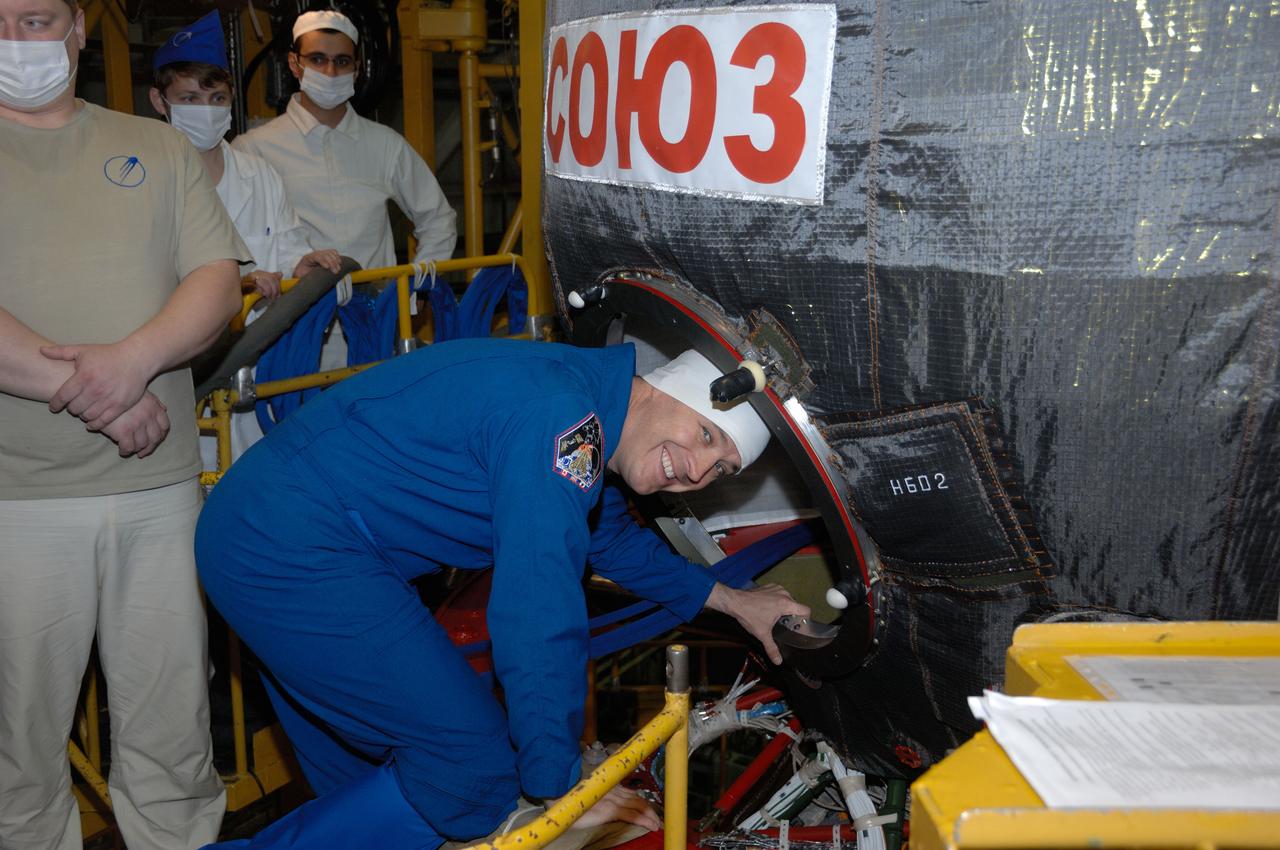In the Integration Facility at the Baikonur Cosmodrome in Kazakhstan, Expedition 50-51 backup crewmember Jack Fischer of NASA climbs aboard the Soyuz MS-03 spacecraft Nov. 2 during pre-launch training. Fischer, Paolo Nespoli of the European Space Agency and Fyodor Yurchikhin of the Russian Federal Space Agency (Roscosmos) will back up the prime crewmembers, Peggy Whitson of NASA, Oleg Novitskiy of Roscosmos and Thomas Pesquet of the European Space Agency, who will launch Nov. 18, Baikonur time, for a six-month mission on the International Space Station. NASA/Alexander Vysotsky