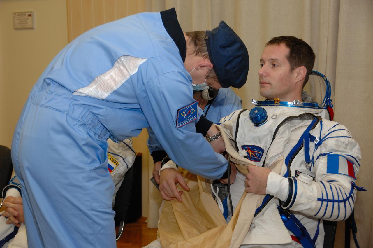 In the Integration Facility at the Baikonur Cosmodrome in Kazakhstan, Expedition 50-51 crewmember Thomas Pesquet of the European Space Agency suits up Nov. 2 for a fit check dress rehearsal in the Soyuz MS-03 spacecraft. Pesquet, Peggy Whitson of NASA and Oleg Novitskiy of the Russian Federal Space Agency (Roscosmos) will launch Nov. 18, Baikonur time, for a six-month mission on the International Space Station. NASA/Alexander Vysotsky