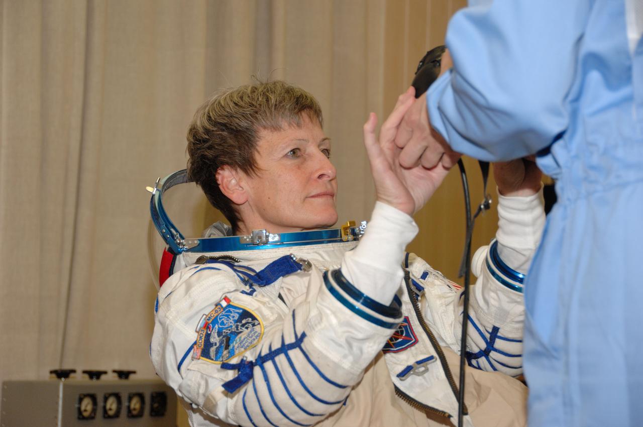 In the Integration Facility at the Baikonur Cosmodrome in Kazakhstan, Expedition 50-51 crewmember Peggy Whitson of NASA suits up Nov. 2 for a fit check dress rehearsal in the Soyuz MS-03 spacecraft. Whitson, Oleg Novitskiy of the Russian Federal Space Agency (Roscosmos) and Thomas Pesquet of the European Space Agency will launch Nov. 18, Baikonur time, for a six-month mission on the International Space Station. NASA/Alexander Vysotsky