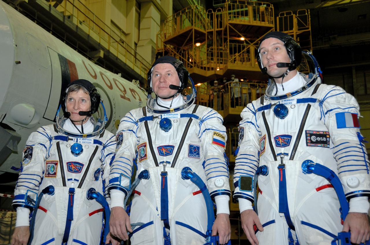 In the Integration Facility at the Baikonur Cosmodrome in Kazakhstan, Expedition 50-51 crewmembers Peggy Whitson of NASA (left), Oleg Novitskiy of the Russian Federal Space Agency (Roscosmos, center) and Thomas Pesquet of the European Space Agency (right) pose for pictures Nov. 2 during a fit check dress rehearsal of their Soyuz MS-03 spacecraft. They will launch Nov. 18, Baikonur time, for a six-month mission on the International Space Station. NASA/Alexander Vysotsky