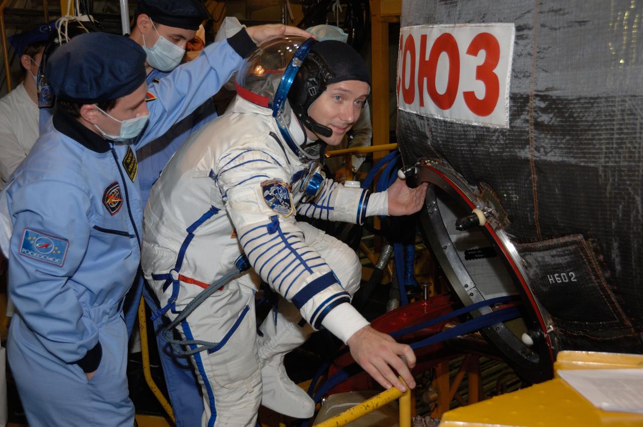 In the Integration Facility at the Baikonur Cosmodrome in Kazakhstan, Expedition 50-51 crewmember Thomas Pesquet of the European Space Agency boards the Soyuz MS-03 spacecraft Nov. 2 during a fit check dress rehearsal. Pesquet, Peggy Whitson of NASA and Oleg Novitskiy of the Russian Federal Space Agency (Roscosmos) will launch Nov. 18, Baikonur time, for a six-month mission on the International Space Station. NASA/Alexander Vysotsky