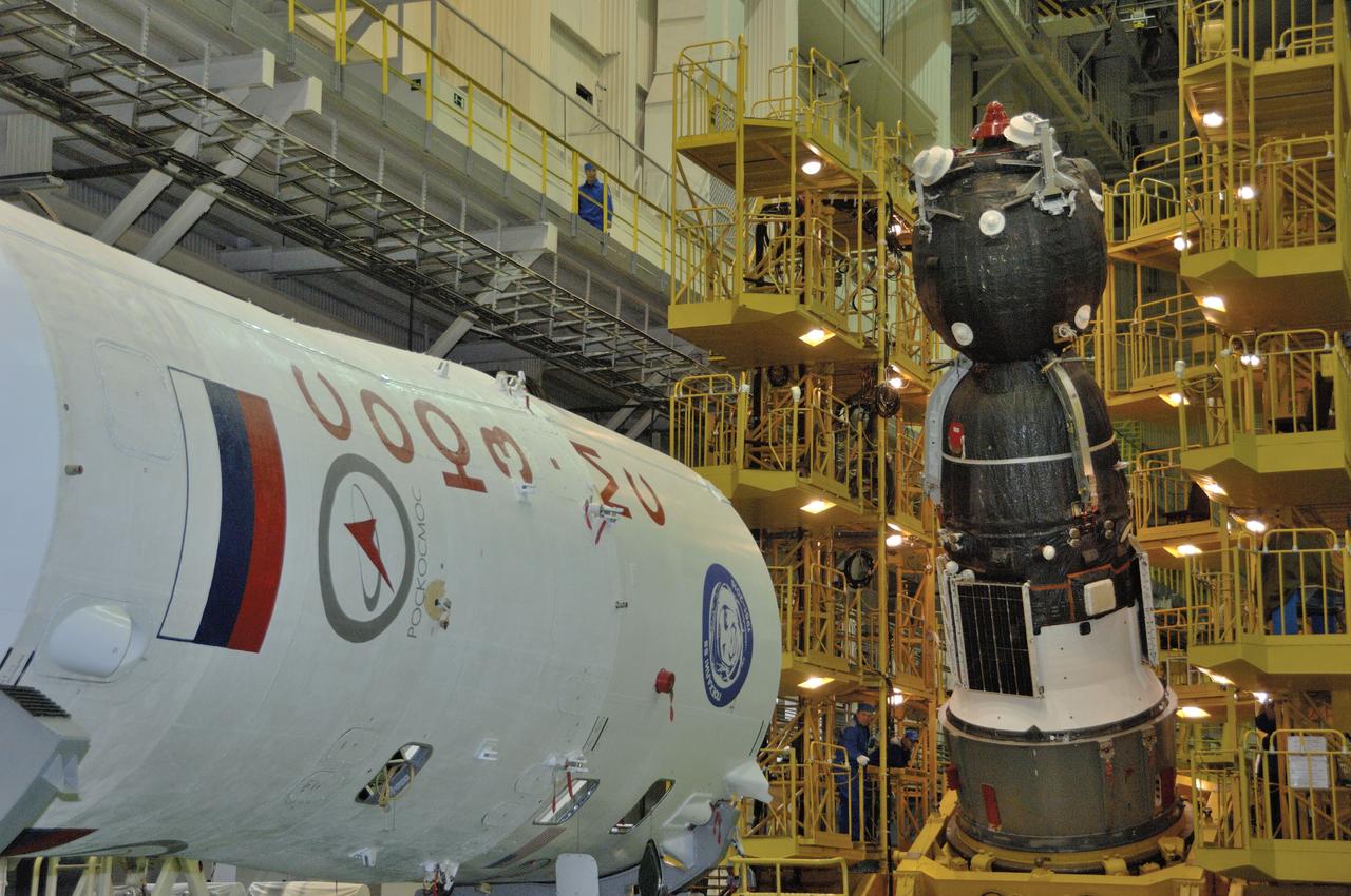 In the Integration Facility at the Baikonur Cosmodrome in Kazakhstan, the Soyuz MS-03 spacecraft begins its rotation into position for its encapsulation into the upper stage of its Soyuz booster Nov. 9. Expedition 50-51 crewmembers Peggy Whitson of NASA, Oleg Novitskiy of the Russian Federal Space Agency (Roscosmos) and Thomas Pesquet of the European Space Agency will launch on the Soyuz Nov. 18, Baikonur time, for a six-month mission on the International Space Station. NASA/Alexander Vysotsky