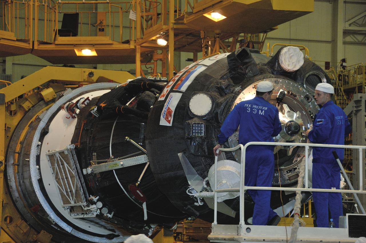 In the Integration Facility at the Baikonur Cosmodrome in Kazakhstan, technicians complete work on the Soyuz MS-03 spacecraft for its encapsulation into the upper stage of its Soyuz booster Nov. 9. Expedition 50-51 crewmembers Peggy Whitson of NASA, Oleg Novitskiy of the Russian Federal Space Agency (Roscosmos) and Thomas Pesquet of the European Space Agency will launch on the Soyuz Nov. 18, Baikonur time, for a six-month mission on the International Space Station. NASA/Alexander Vysotsky