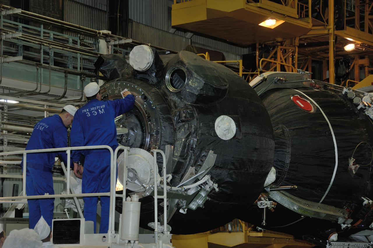 In the Integration Facility at the Baikonur Cosmodrome in Kazakhstan, technicians complete work on the Soyuz MS-03 spacecraft for its encapsulation into the upper stage of its Soyuz booster Nov. 9. Expedition 50-51 crewmembers Peggy Whitson of NASA, Oleg Novitskiy of the Russian Federal Space Agency (Roscosmos) and Thomas Pesquet of the European Space Agency will launch on the Soyuz Nov. 18, Baikonur time, for a six-month mission on the International Space Station. NASA/Alexander Vysotsky