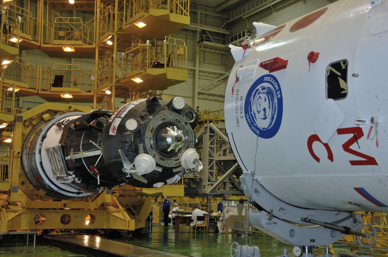 In the Integration Facility at the Baikonur Cosmodrome in Kazakhstan, the Soyuz MS-03 spacecraft (left) its moved toward its encapsulation into the upper stage of its Soyuz booster Nov. 9. Expedition 50-51 crewmembers Peggy Whitson of NASA, Oleg Novitskiy of the Russian Federal Space Agency (Roscosmos) and Thomas Pesquet of the European Space Agency will launch on the Soyuz Nov. 18, Baikonur time, for a six-month mission on the International Space Station. NASA/Alexander Vysotsky