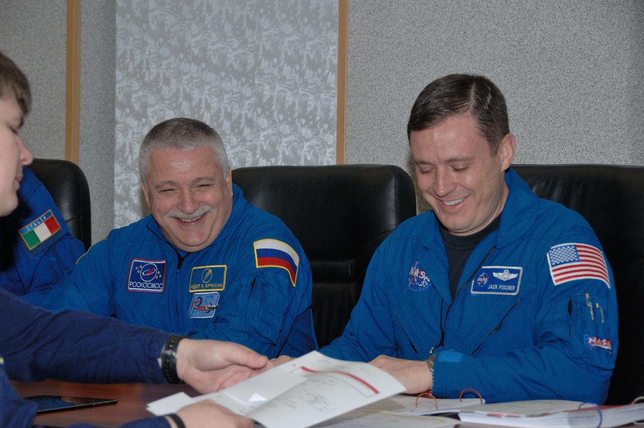At their Cosmonaut Hotel crew quarters in Baikonur, Kazakhstan, Expedition 50-51 backup crewmembers Fyodor Yurchikhin of the Russian Federal Space Agency (Roscosmos, left) and Jack Fischer of NASA (right) share a light-hearted moment as they review flight plans Nov. 10 as part of preflight training. They are backups to the prime crewmembers, Peggy Whitson of NASA, Oleg Novitskiy of Roscosmos and Thomas Pesquet of the European Space Agency, who will launch Nov. 18, Baikonur time, on the Soyuz MS-03 spacecraft for a six-month mission on the International Space Station. NASA/Alexander Vysotsky