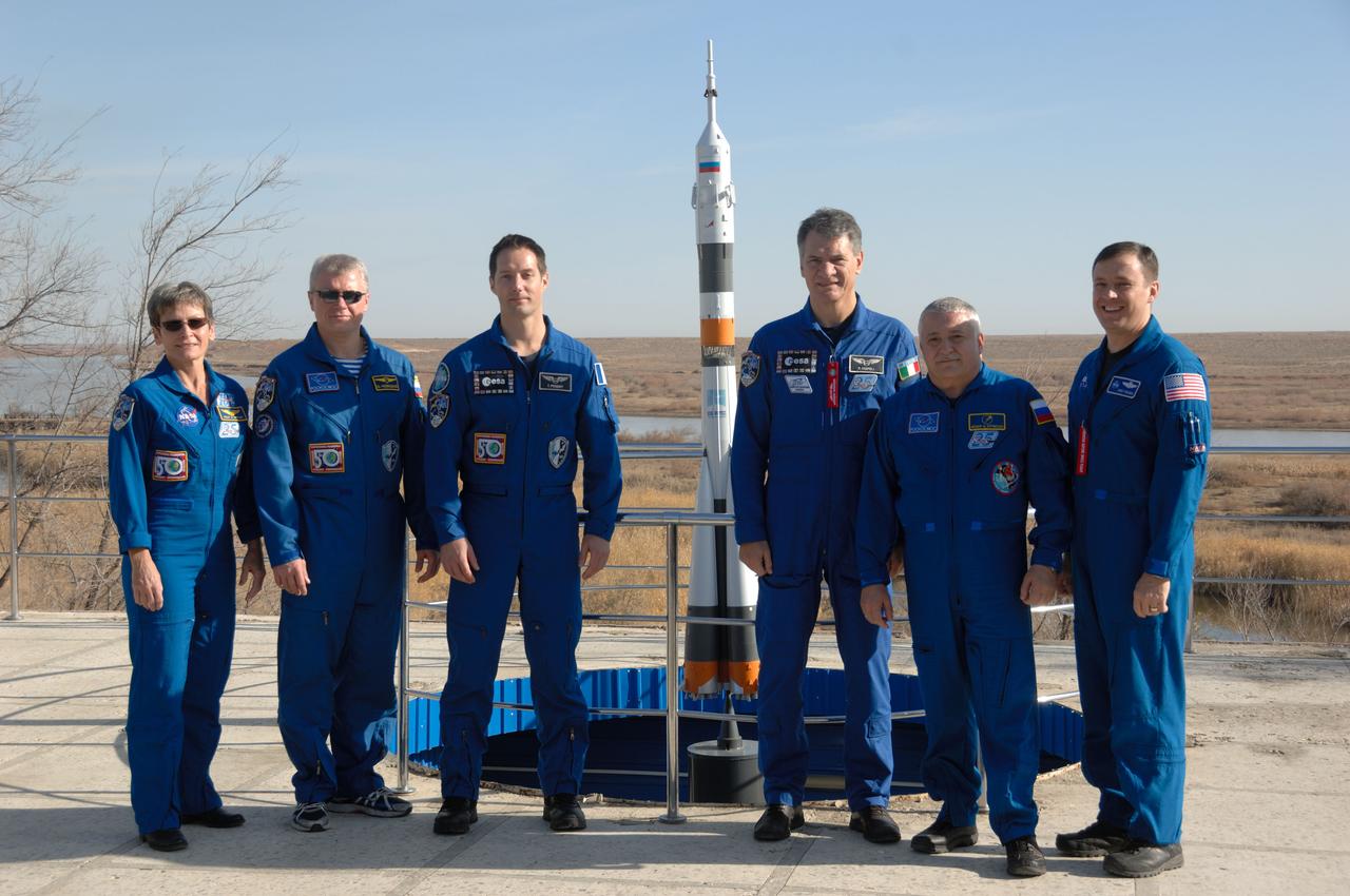 At the Cosmonaut Hotel crew quarters in Baikonur, Kazakhstan, the Expedition 50-51 prime and backup crewmembers pose for pictures Nov. 10 during their prelaunch activities. From left to right are prime crewmembers Peggy Whitson of NASA, Oleg Novitskiy of the Russian Federal Space Agency (Roscosmos) and Thomas Pesquet of the European Space Agency and backup crewmembers Paolo Nespoli of the European Space Agency, Fyodor Yurchikhin of Roscosmos and Jack Fischer of NASA. Novitskiy, Whitson and Pesquet will launch Nov. 18, Baikonur time, on the Soyuz MS-03 spacecraft for a six-month mission on the International Space Station.  NASA/Alexander Vysotsky 