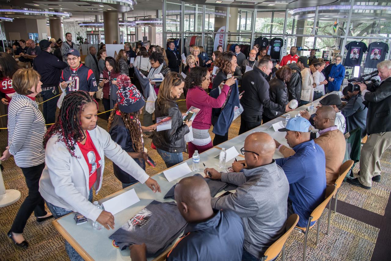jsc2017e009669 (01/26/2017) --- Former NFL players sign autographs for Johnson Space Center (JSC) staff members as part of the JSC Super Bowl Tailgate event. The former NFL Prayers were invited to tour JSC as guests of the Center Director the week before the Super Bowl game. NASA Photographer: Lauren Harnett