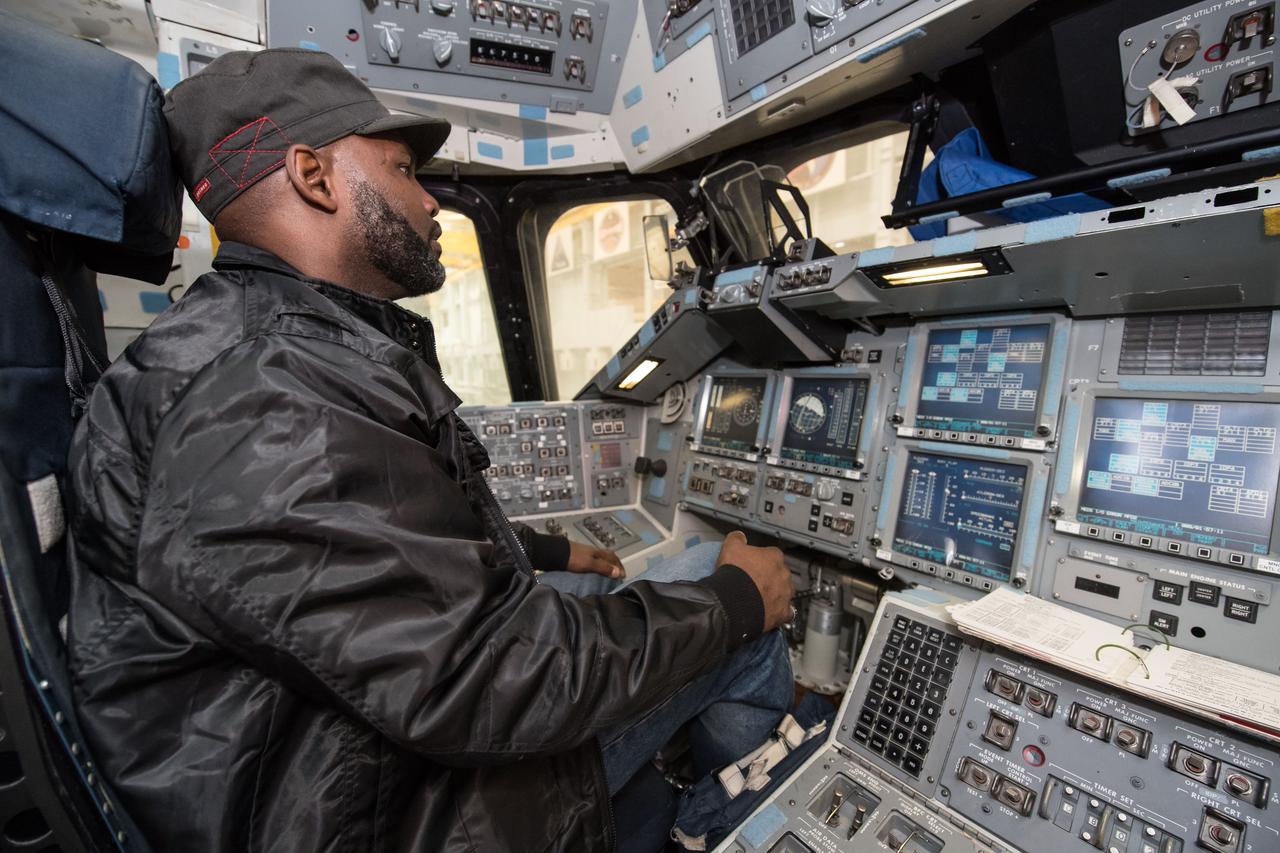 jsc2017e009777 (01/26/2017) --- Former NFL player Kevin Williams (Vikings, Seahawks, Saints) enjoys the tour at the Johnson Space Center (JSC) while getting a hands on look in the NASA Space Shuttle cockpit. Kevin was invited with the other former NFL players to visit JSC as part of the JSC Super Bowl tailgate event. The former NFL players got a chance to visit Mission Control and well as many other areas in the Space Center. They also took time to sign autographs and give picture opportunities to the JSC Staff.