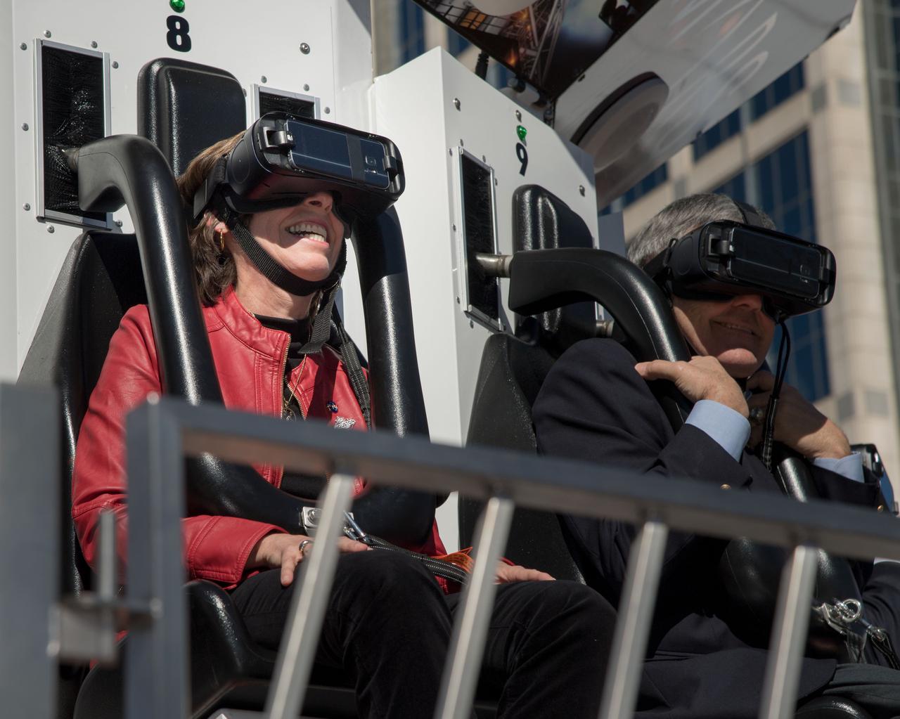 jsc2017e011384 (01/30/2017) --- With virtual reality googles in place, Johnson Space Center Director Ellen Ochoa and Kennedy Space Center Director Robert Cabana prepare for the Journey to Mars ride that will pull the Orion capsule up 90 feet and suddenly drop them, while they experience a virtual trip to Mars and back. The Houston Texas Super Bowl Live event at Discovery Green lasts through the 5th of February and has an estimated 100,000 visitors each day. The Mars ride is but one of the many attractions that NASA has provided in their Future Flight area. NASA PHOTOGRAPHER Bill Stafford