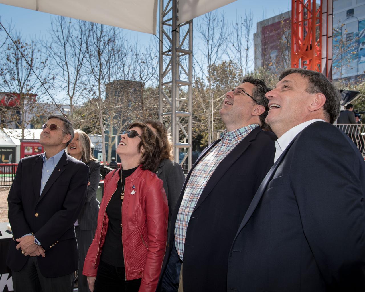 jsc2017e011392 (01/30/2017) --- NASA Center Directors and the Orion Program Manager watch the NASA Super Bowl Virtual Reality ride, move up on its Journey to Mars and back experience Jan 30, 2017.. This is one of the most popular experiences in the Houston Texas Super Bowl Future Flight activities at the Discovery Green. Kennedy Space Center Director Robert Cabana (far Left) Johnson Space Center Director Ellen Ochoa, Marshal Space Flight Center Director Todd May and Orion Program Manager Mark Kirasich all enjoy the sight as they prepare to take the journey themselves. NASA PHOTOGRAPHER: Bill Stafford