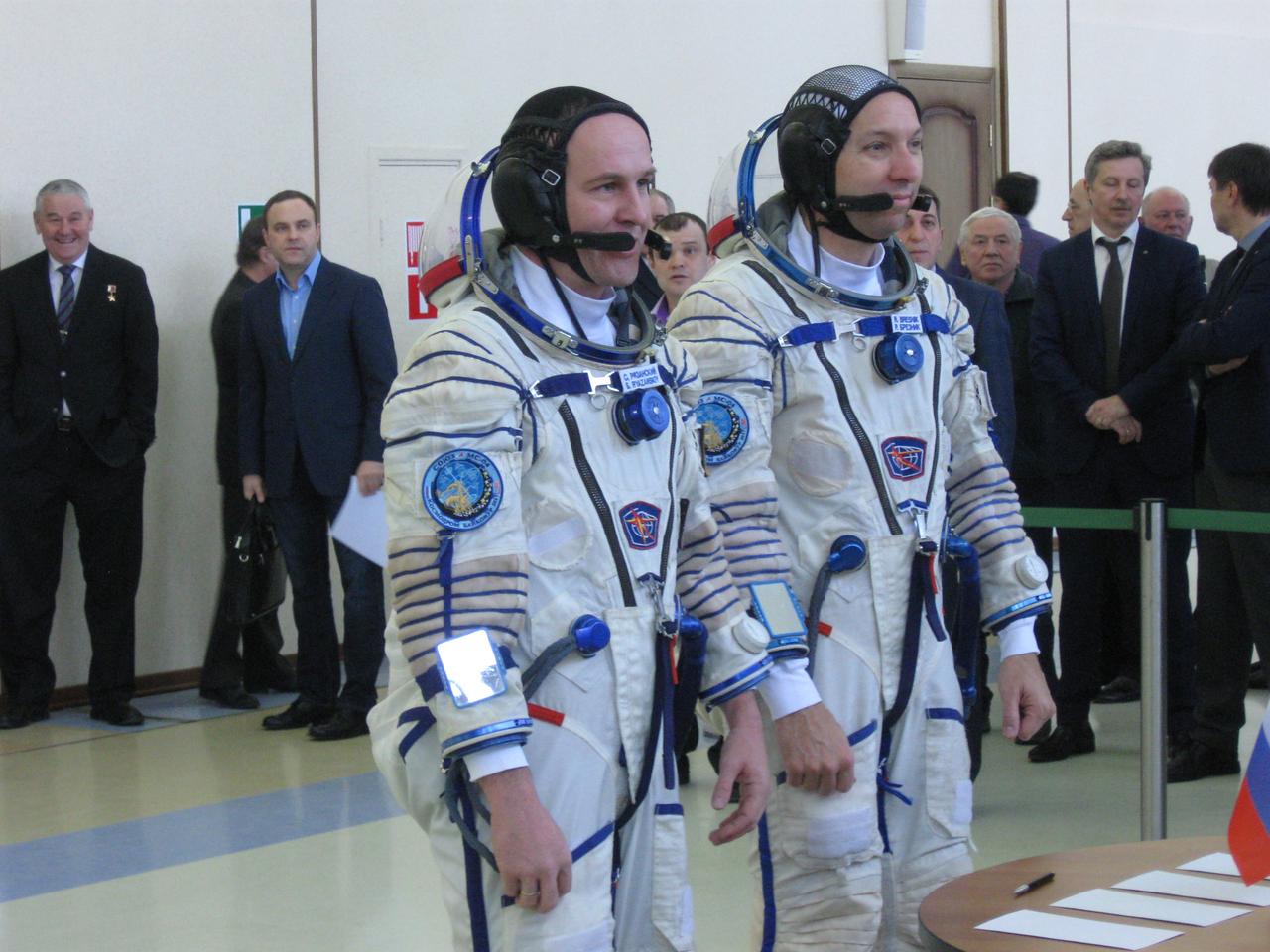 jsc2017e038541 (March 30, 2017) --- At the Gagarin Cosmonaut Training Center in Star City, Russia, Expedition 51 backup crewmembers Sergey Ryazanskiy of the Russian Federal Space Agency (Roscosmos, left) and Randy Bresnik of NASA (right) report to State Commission officials March 30 for the start of two days of final crew qualification exams. They are backups to Fyodor Yurchikhin of Roscosmos and Jack Fischer of NASA, who will launch April 20 on the Soyuz MS-04 spacecraft from the Baikonur Cosmodrome in Kazakhstan for a four and a half month mission on the International Space Station. Credit: NASA/Rob Navias