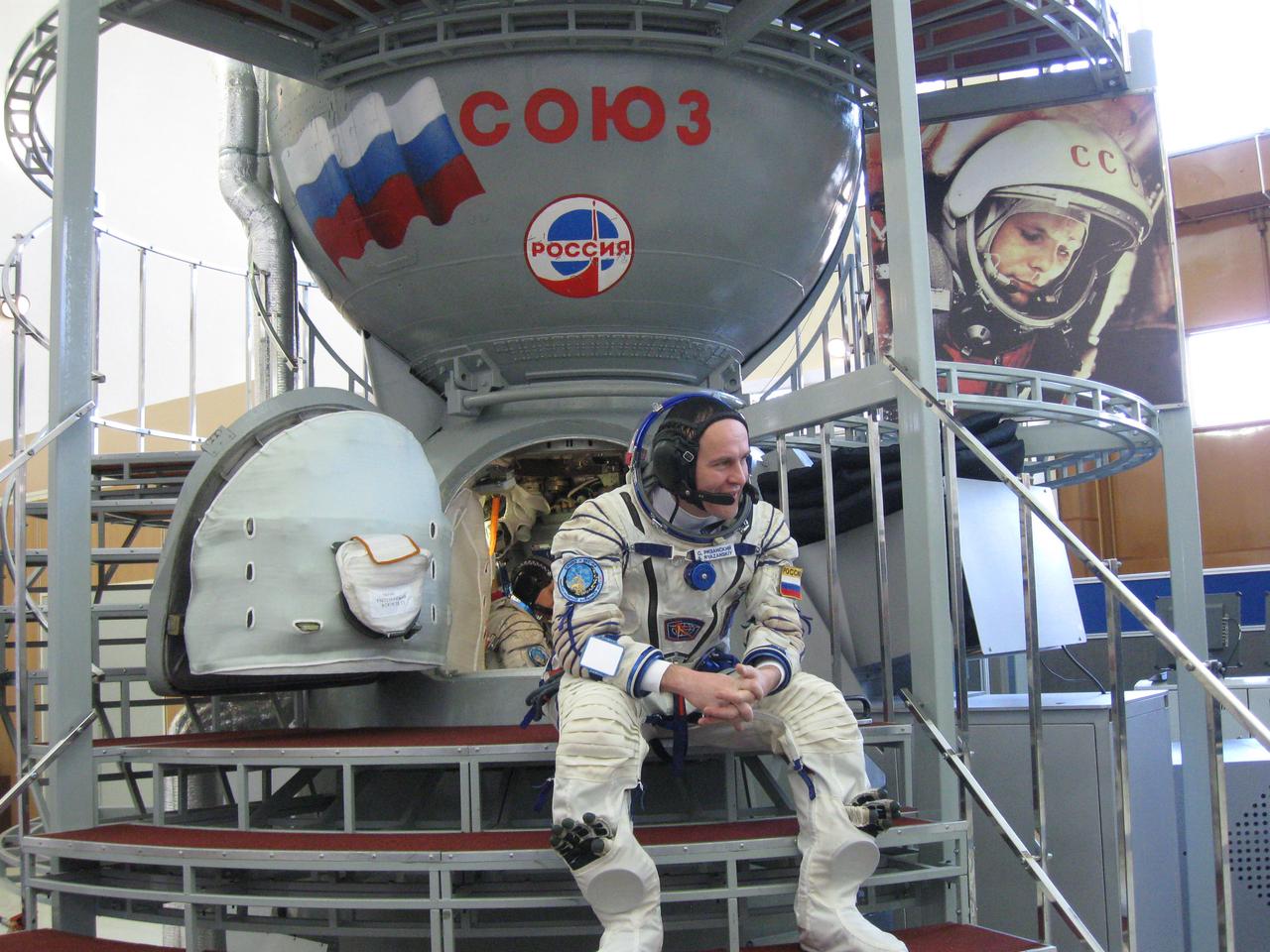 jsc2017e038545 (March 30, 2017) --- At the Gagarin Cosmonaut Training Center in Star City, Russia, Expedition 51 backup crewmember Sergey Ryazanskiy of the Russian Federal Space Agency (Roscosmos) waits to board a Soyuz training mockup March 30 as his crewmate, Randy Bresnik of NASA, works inside as part of final crew qualification exams. They are backups to Fyodor Yurchikhin of Roscosmos and Jack Fischer of NASA, who will launch April 20 on the Soyuz MS-04 spacecraft from the Baikonur Cosmodrome in Kazakhstan for a four and a half month mission on the International Space Station. Credit: NASA/Rob Navias