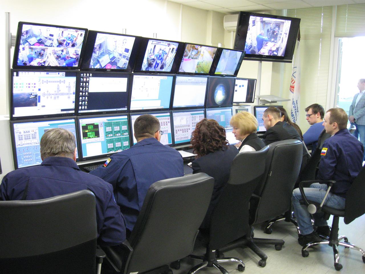 jsc2017e038549 (March 30, 2017) --- At the Gagarin Cosmonaut Training Center in Star City, Russia, trainers keep tabs on the work of Expedition 51 crewmembers Fyodor Yurchikhin of the Russian Federal Space Agency (Roscosmos) and Jack Fischer of NASA through a bank of video monitors and data displays March 30 as the crew conducted the first of two days of final qualification exams. Yurchikhin and Fischer will launch April 20 on the Soyuz MS-04 spacecraft from the Baikonur Cosmodrome in Kazakhstan for a four and a half month mission on the International Space Station. Credit: NASA/Rob Navias