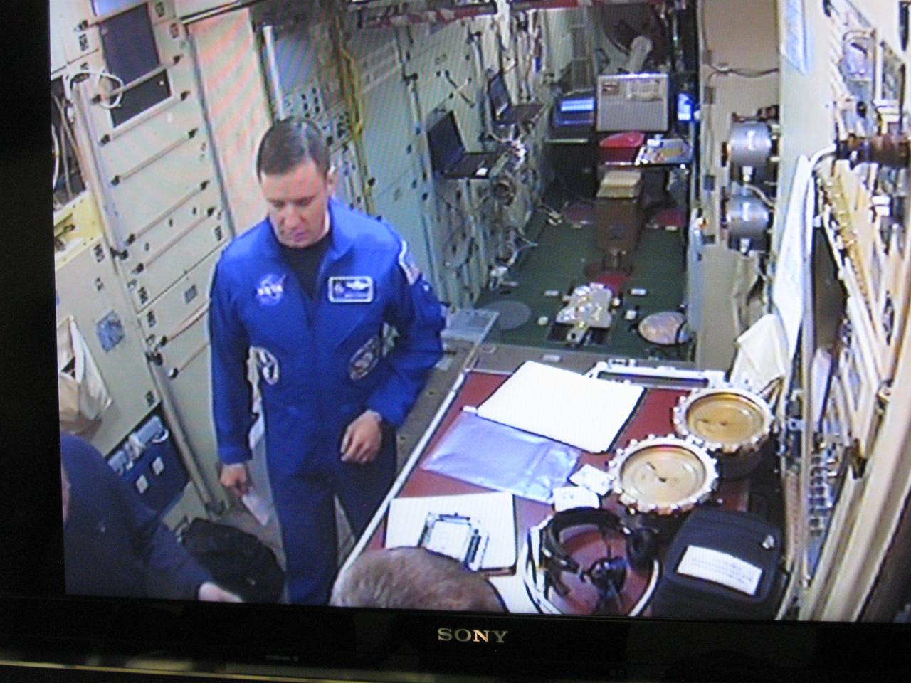 jsc2017e038550 (March 30, 2017) --- At the Gagarin Cosmonaut Training Center in Star City, Russia, Expedition 51 crewmember Jack Fischer of NASA is seen inside a Russian segment systems mockup on a TV monitor being viewed by trainers March 30 as he and Fyodor Yurchikhin of the Russian Federal Space Agency (Roscosmos) began two days of final qualification exams. Fischer and Yurchikhin will launch April 20 on the Soyuz MS-04 spacecraft from the Baikonur Cosmodrome in Kazakhstan for a four and a half month mission on the International Space Station. Credit: NASA/Rob Navias