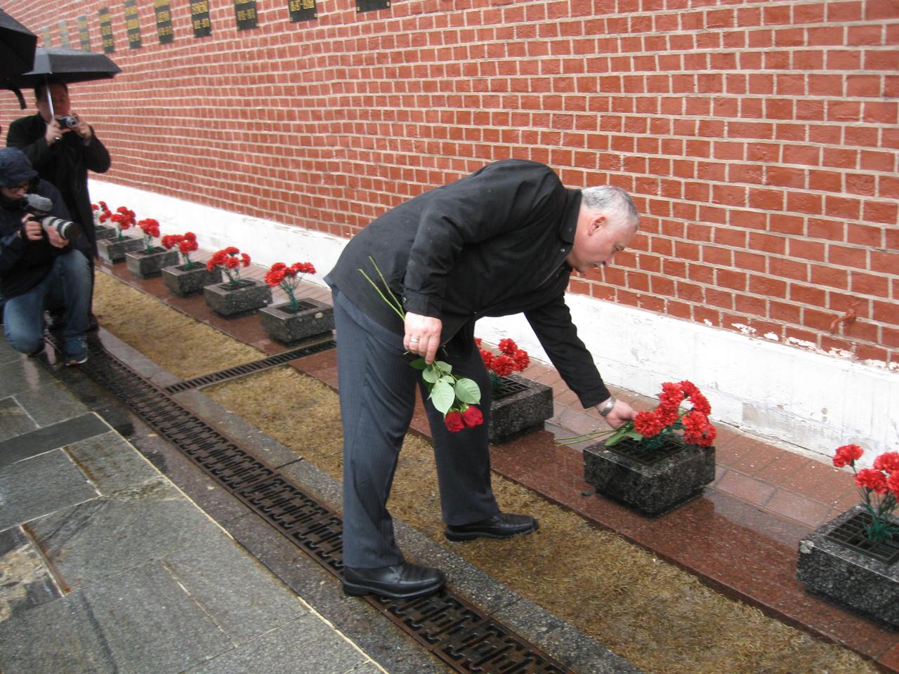 jsc2017e039458 (04/03/2017) --- At the Kremlin Wall in Red Square in Moscow, Expedition 51 crewmember Fyodor Yurchikhin of the Russian Federal Space Agency (Roscosmos) lays flowers at the site where Russian space icons are interred during traditional ceremonies April 3. Yurchikhin and Jack Fischer of NASA will launch April 20 on the Soyuz MS-04 spacecraft from the Baikonur Cosmodrome in Kazakhstan for a four and a half month mission on the International Space Station. Photo: NASA/Rob Navias.