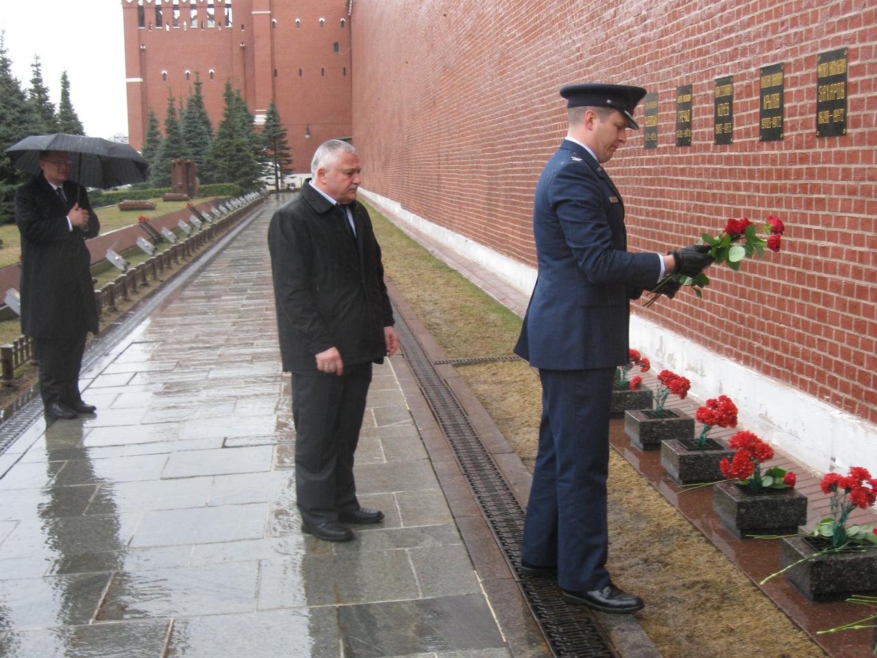 jsc2017e039460 (04/03/2017) --- At the Kremlin Wall in Red Square in Moscow. Expedition 51 crewmember Jack Fischer of NASA lays flowers at the site where Russian space icons are interred during traditional ceremonies April 3. Looking on is his crewmate, Fyodor Yurchikhin of the Russian Federal Space Agency (Roscosmos, left)). They will launch April 20 on the Soyuz MS-04 spacecraft from the Baikonur Cosmodrome in Kazakhstan for a four and a half month mission on the International Space Station. Photo: NASA/Rob Navias