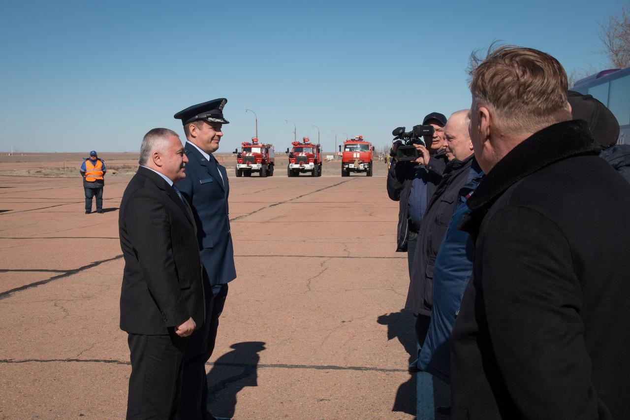 jsc2017e039898 (04/05/2017) --- Expedition 51 crewmembers Fyodor Yurchikhin of the Russian Federal Space Agency (Roscosmos, left) and Jack Fischer of NASA are greeted by Russian space officials at their launch site in Baikonur, Kazakhstan April 5 after a flight from the Gagarin Cosmonaut Training Center in Star City, Russia for final pre-launch training. Fischer and Yurchikhin will launch April 20 on the Soyuz MS-04 spacecraft for a four and a half month mission on the International Space Station. Photo: NASA/Victor Zelentsov