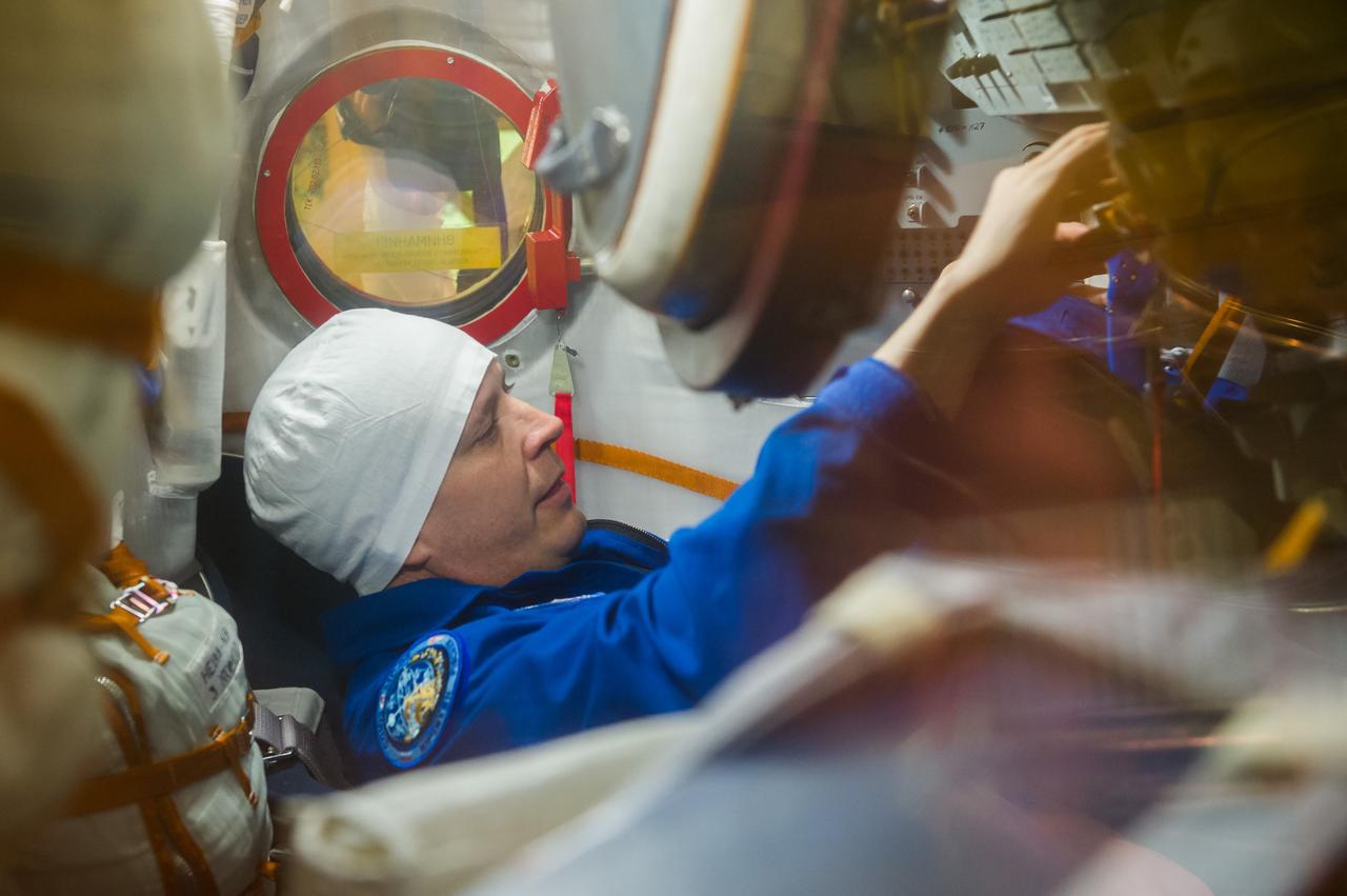 jsc2017e040283 (April 6, 2017) --- In the Integration Building at the Baikonur Cosmodrome in Kazakhstan, Expedition 51 crewmember Jack Fischer of NASA checks out systems in the Soyuz MS-04 spacecraft April 6 as part of pre-launch preparations. Fischer and Fyodor Yurchikhin of the Russian Federal Space Agency (Roscosmos) will launch April 20 on the Soyuz MS-04 spacecraft for a four and a half month mission on the International Space Station. NASA/Gagarin Cosmonaut Training Center/Andrey Shelepin