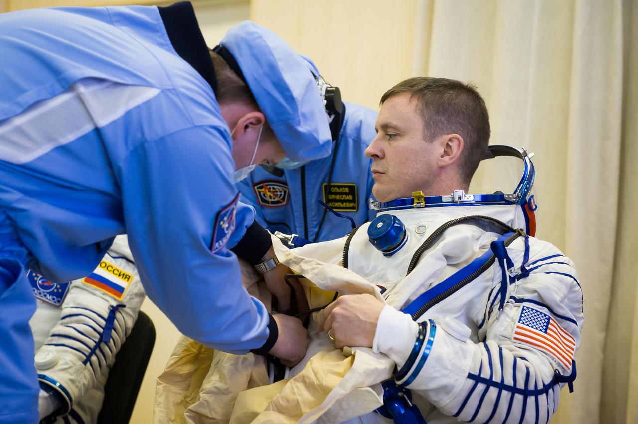 jsc2017e040285 (April 6, 2017) --- In the Integration Building at the Baikonur Cosmodrome in Kazakhstan, Expedition 51 crewmember Jack Fischer of NASA suits up April 6 for a fit check in the Soyuz MS-04 spacecraft as part of pre-launch preparations. Fischer and Fyodor Yurchikhin of the Russian Federal Space Agency (Roscosmos) will launch April 20 on the Soyuz MS-04 spacecraft for a four and a half month mission on the International Space Station. NASA/Gagarin Cosmonaut Training Center/Andrey Shelepin