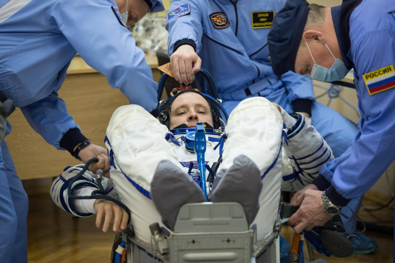 jsc2017e040286 (April 6, 2017) --- In the Integration Building at the Baikonur Cosmodrome in Kazakhstan, Expedition 51 crewmember Jack Fischer of NASA undergoes a leak check of his Russian Sokol launch and entry suit April 6 prior to climbing aboard the Soyuz MS-04 spacecraft as part of pre-launch preparations. Fischer and Fyodor Yurchikhin of the Russian Federal Space Agency (Roscosmos) will launch April 20 on the Soyuz MS-04 spacecraft for a four and a half month mission on the International Space Station. NASA/Gagarin Cosmonaut Training Center/Andrey Shelepin