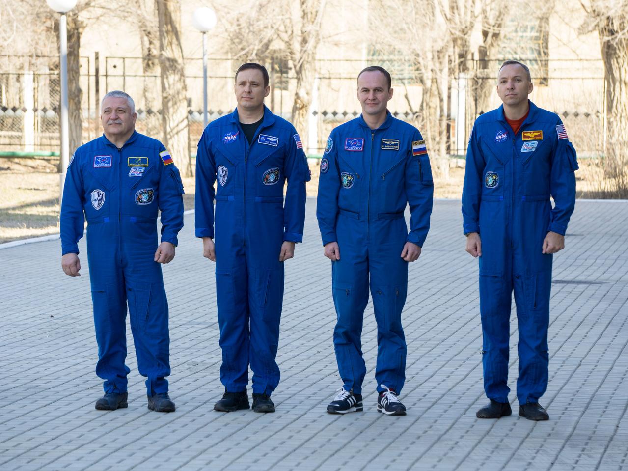 jsc2017e040339 (April 7, 2017) --- At the Cosmonaut Hotel crew quarters in Baikonur, Kazakhstan, the Expedition 51 prime and backup crewmembers attend flag-raising ceremonies April 7 as part of their pre-launch activities. From left to right are prime crewmembers Fyodor Yurchikhin of the Russian Federal Space Agency (Roscosmos) and Jack Fischer of NASA and backup crewmembers Sergey Ryazanskiy of Roscosmos and Randy Bresnik of NASA. Yurchikhin and Fischer will launch April 20 on the Soyuz MS-04 spacecraft from the Baikonur Cosmodrome for a four and a half month mission on the International Space Station. NASA/Victor Zelentsov
