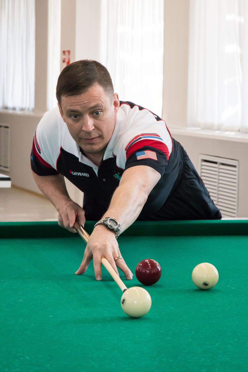 jsc2017e043071 (April 13, 2017) --- At the Cosmonaut Hotel crew quarters in Baikonur, Kazakhstan, Expedition 51 crewmember Jack Fischer of NASA tries his hand in a game of billiards April 13 as part of his pre-launch activities. Fischer and Fyodor Yurchikhin of the Russian Federal Space Agency (Roscosmos) will liftoff April 20 from the Baikonur Cosmodrome on the Soyuz MS-04 spacecraft for a four and a half month mission on the International Space Station. NASA/Victor Zelentsov