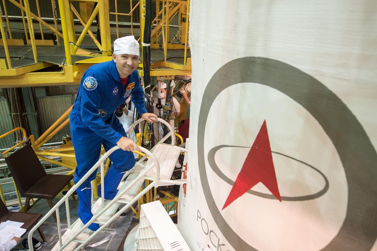 jsc2017e043845 (April 14, 2017) --- In the Integration Facility at the Baikonur Cosmodrome in Kazakhstan, Expedition 51 backup crewmember Randy Bresnik of NASA enters the Soyuz MS-04 spacecraft April 14 during a final training session. Bresnik and Sergey Ryazanskiy of the Russian Federal Space Agency (Roscosmos) are serving as backups to Fyodor Yurchikhin of Roscosmos and Jack Fischer of NASA, who will launch April 20 on the Soyuz MS-04 spacecraft for a four and a half month mission on the International Space Station. Credit: NASA/Gagarin Cosmonaut Training Center/Andrey Shelepin