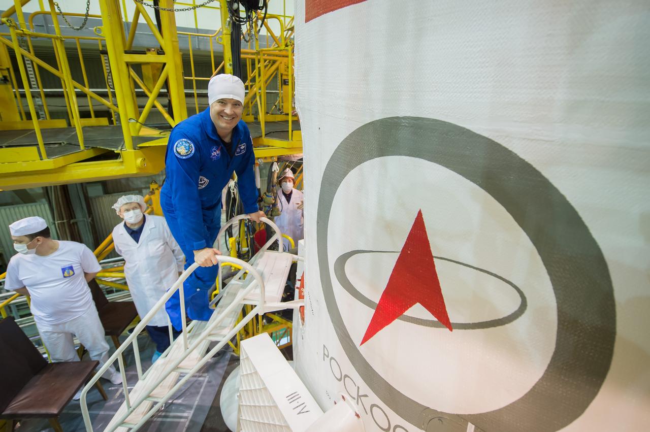 jsc2017e043847 (April 14, 2017) --- In the Integration Facility at the Baikonur Cosmodrome in Kazakhstan, Expedition 51 crewmember Jack Fischer of NASA enters the Soyuz MS-04 spacecraft April 14 during a final training session. Fischer and Fyodor Yurchikhin of the Russian Federal Space Agency (Roscosmos) will launch April 20 on the Soyuz MS-04 spacecraft for a four and a half month mission on the International Space Station. Credit: NASA/Gagarin Cosmonaut Training Center/Andrey Shelepin