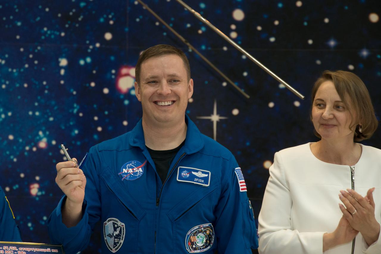 jsc2017e043853 (April 14, 2017) --- At the Baikonur Cosmodrome Museum in Kazakhstan, Expedition 51 crewmember Jack Fischer of NASA displays a “launch Key” during a tour of the facility April 14. The “launch key” is the device that triggers the engine ignition sequence at the launch pad for a Soyuz rocket launch. Fischer and Fyodor Yurchikhin of the Russian Federal Space Agency (Roscosmos) and Jack Fischer of NASA. Yurchikhin and Fischer will launch April 20 on the Soyuz MS-04 spacecraft for a four and a half month mission on the International Space Station. Credit: .NASA/Victor Zelentsov