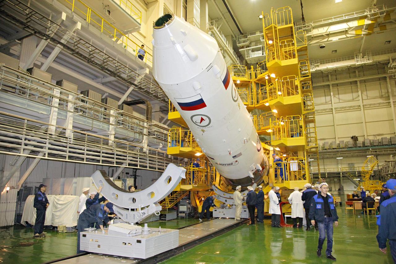 jsc2017e044355 (April 12, 2017) --- In the Integration Facility at the Baikonur Cosmodrome in Kazakhstan, the upper stage of a Soyuz booster is raised back onto its test stand April 12 after the Soyuz MS-04 spacecraft was encapsulated in the rocket segment. The Soyuz rocket’s three stages were then mated together on April 15 in advance of the launch of Expedition 51 crewmembers Fyodor Yurchikhin of the Russian Federal Space Agency (Roscosmos) and Jack Fischer of NASA April 20 on the Soyuz MS-04 spacecraft from Baikonur for a four and a half month mission on the International Space Station. Photo Credit: (Roscosmos)