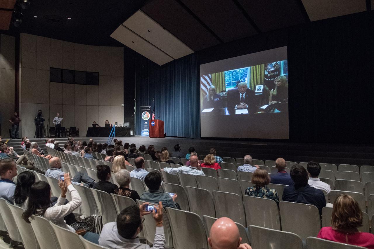 jsc2017e049146 (April 24, 2017) --- Johnson Space Center employees and Center Director watch President Donald Trump call Peggy Whitson on space station for her record-breaking stay aboard the International Space Station. (Photo Credit: NASA/Allison Bills)